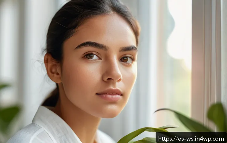 천연 스킨케어의 성과 측정 방법 - A close-up portrait of a young Hispanic woman examining her smooth, glowing facial skin in natural d...
